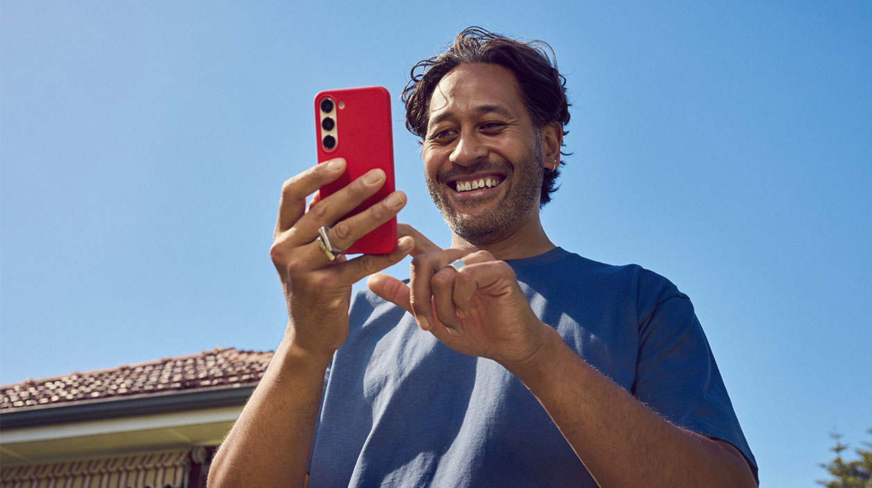 Man on phone outside of house