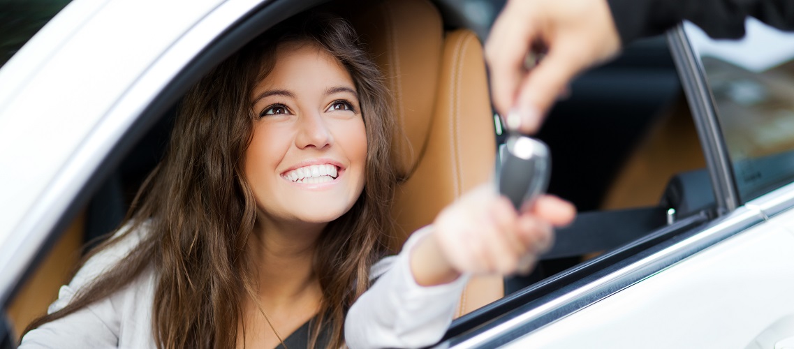 woman smiling with car keys