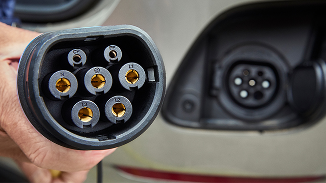 Where is the charge port on my electric car?