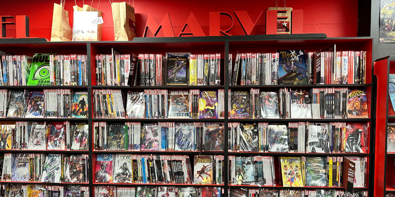 Store shelf lined with comic books