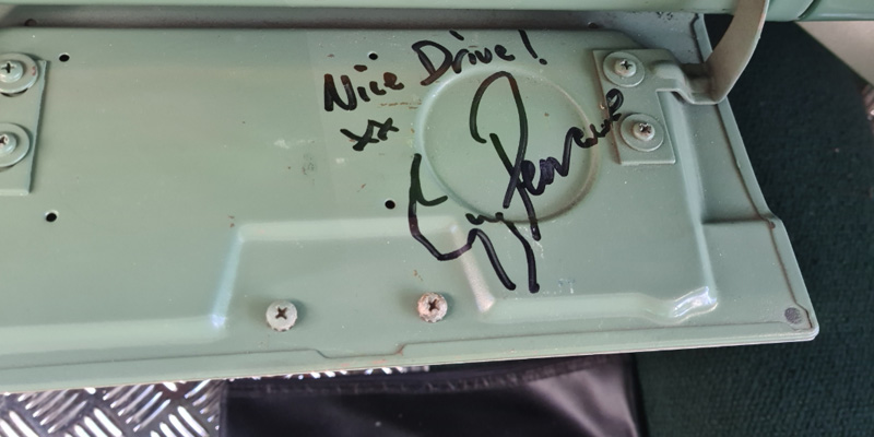 the signature of guy pearce on the body of a safari station wagon