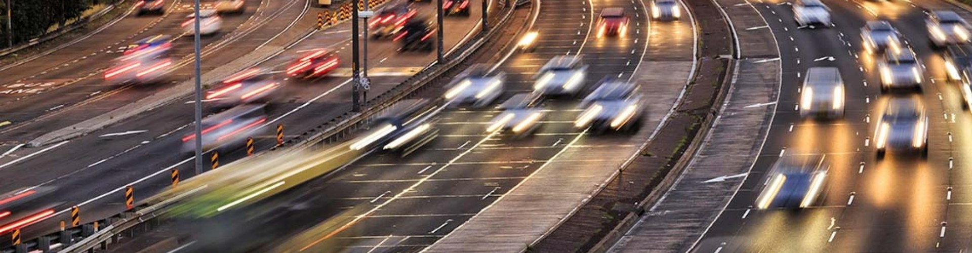 Ariel view of two-way traffic on busy highway roads.