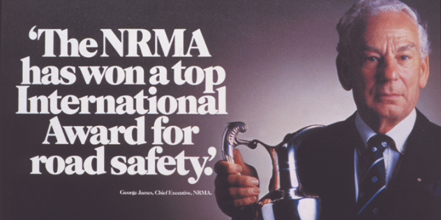 George James NRMA chief executive in 1986 with the FIA road safety challenge trophy