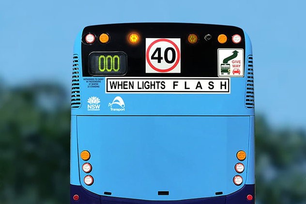 Flashing lights on the back of a bus