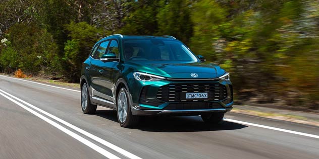 Turquoise MG ZS driving