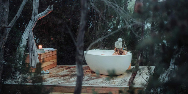 A woman in an outdoor bath