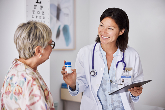 A woman getting medicine advice from a doctor.