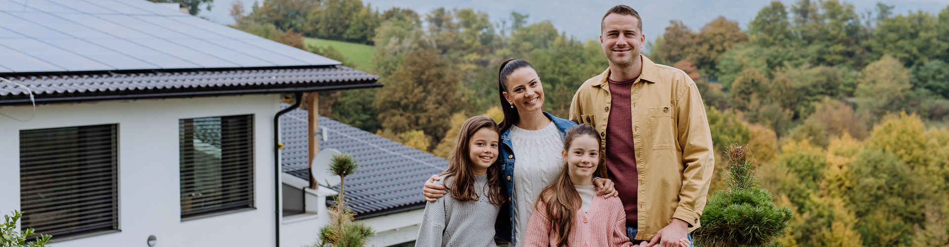 A family standing outside their house