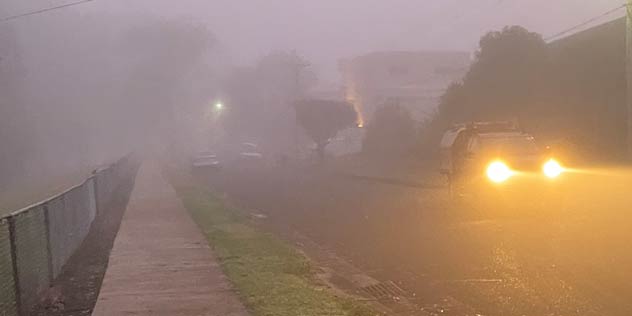 A ute with fog lights on a foggy street