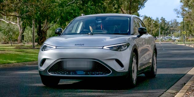 A Smart #3 driving on a road