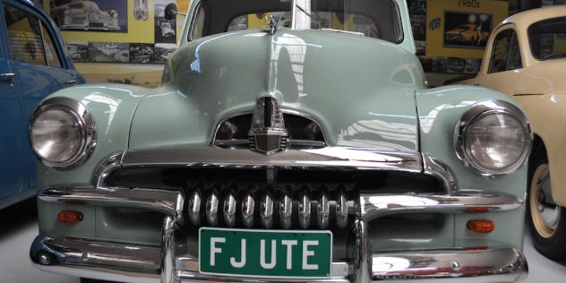 A mint green 1950 Holden FJ Ute.