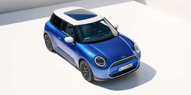 A parked blue 2024 Mini Cooper E/SE, seen from overhead