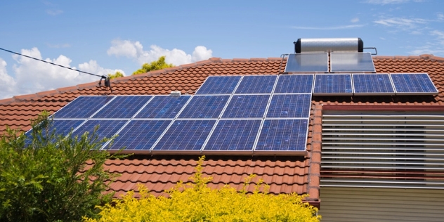 Solar panels and a solar hot-water heater on a residential roof