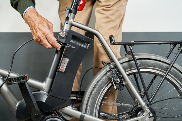 Man charging up an e-bike.