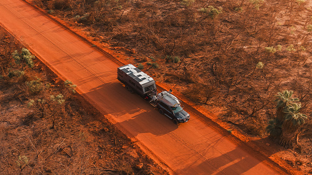 Towing across a red sand road