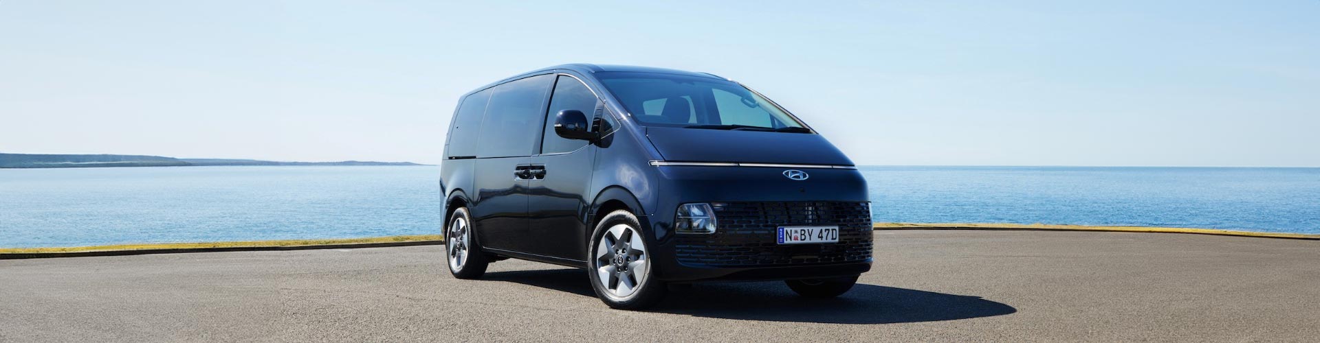 2022 Hyundai Staria van parked next to body of water
