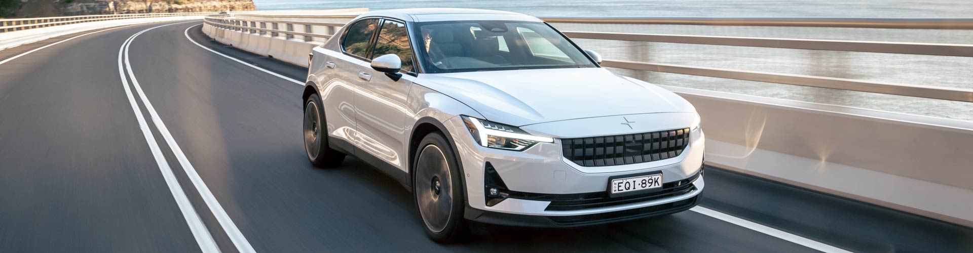 Grey 2022 Polestar 2 driving on Seacliff bridge