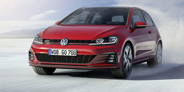 A red VW GTI speeding along crisp white salt flats, leaving a trail of white dust.