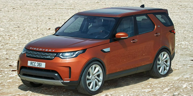 Front-angle view of an orange Ranger Rover SUV.