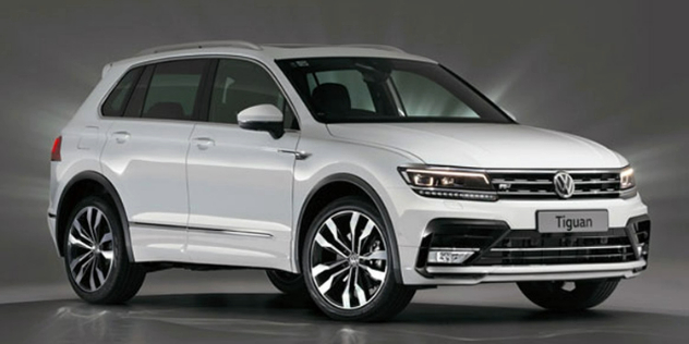 A white VW Tiguan parked in a grey showroom.