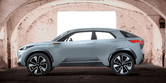 Side view of a grey Hyundai SUV parked underneath a light pink archway.