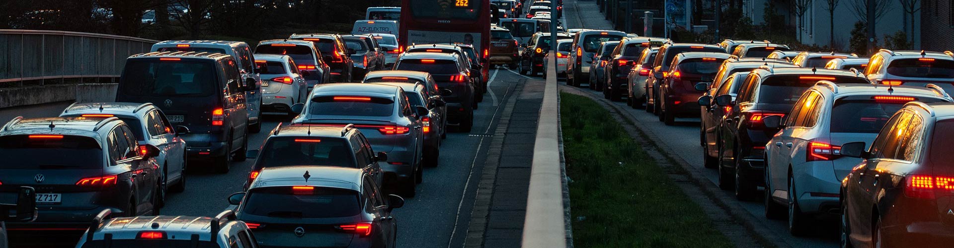 Traffic congestion on a busy city road in the evening
