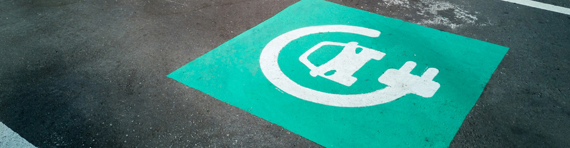 A parking bay reserved for electric vehicle charging