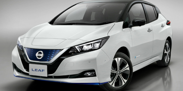 Front-angle view of a white Nissan Leaf E-Plus.