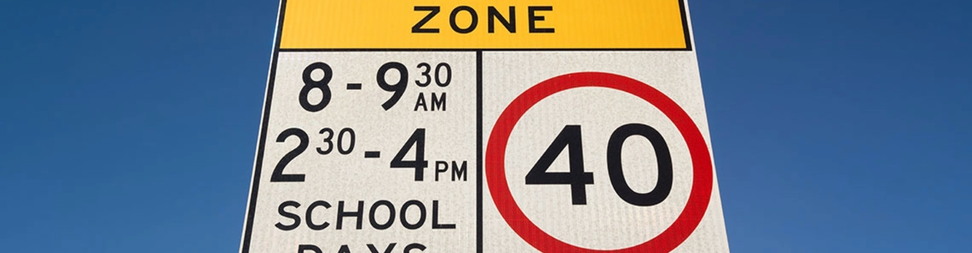 A school-zone speed limit road sign