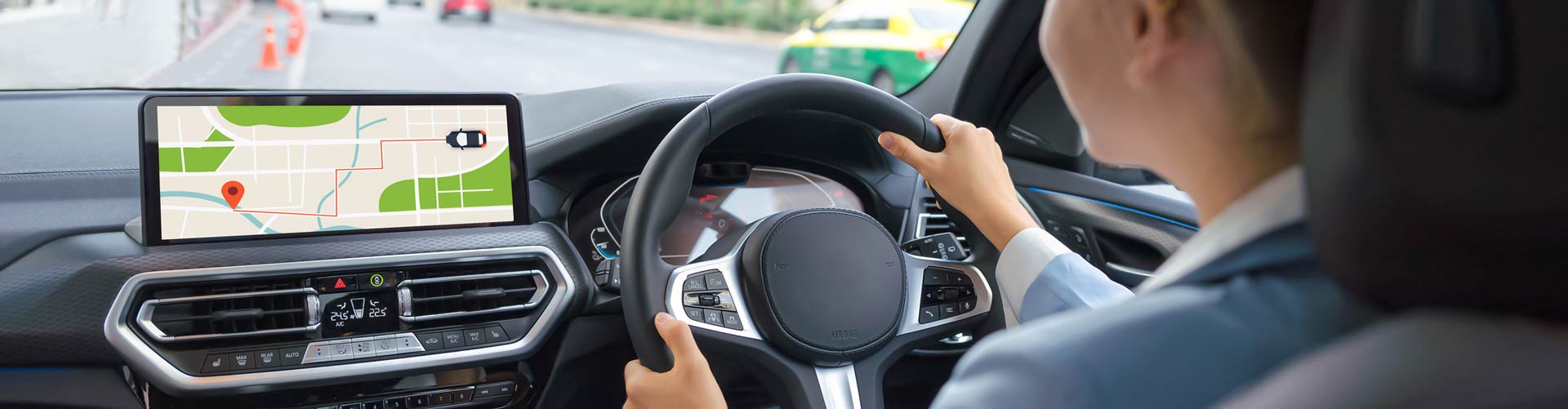 Woman driving car with navigation system showing map
