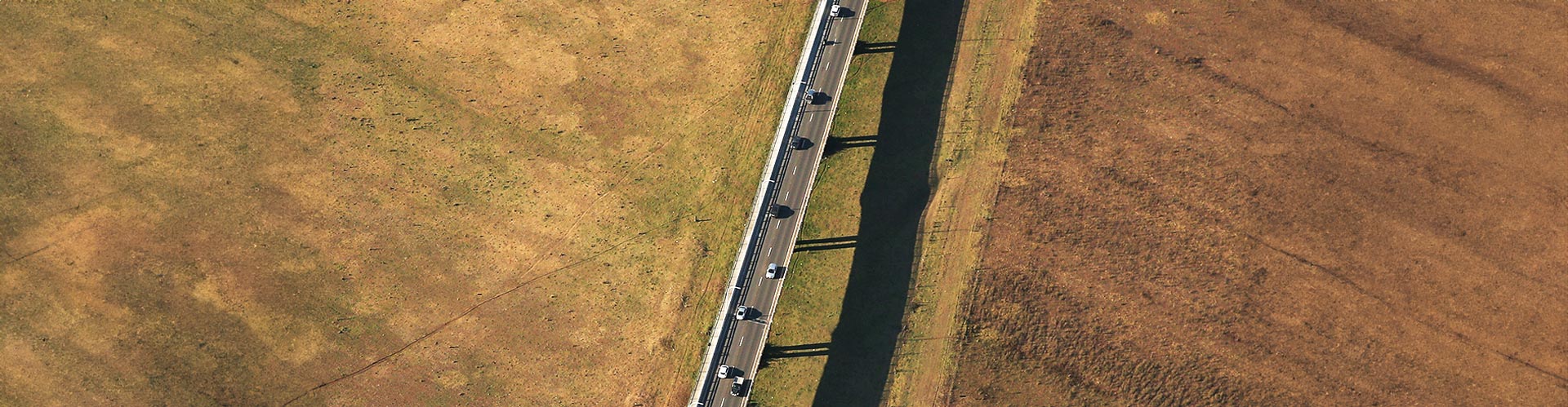 Aerial view of a highway crossing arid land