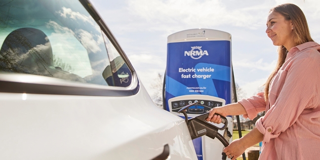 woman using an NRMA fast charger