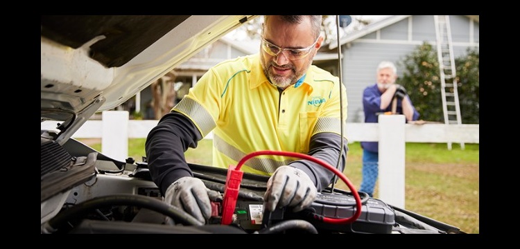 NRMA service provider installing a car battery