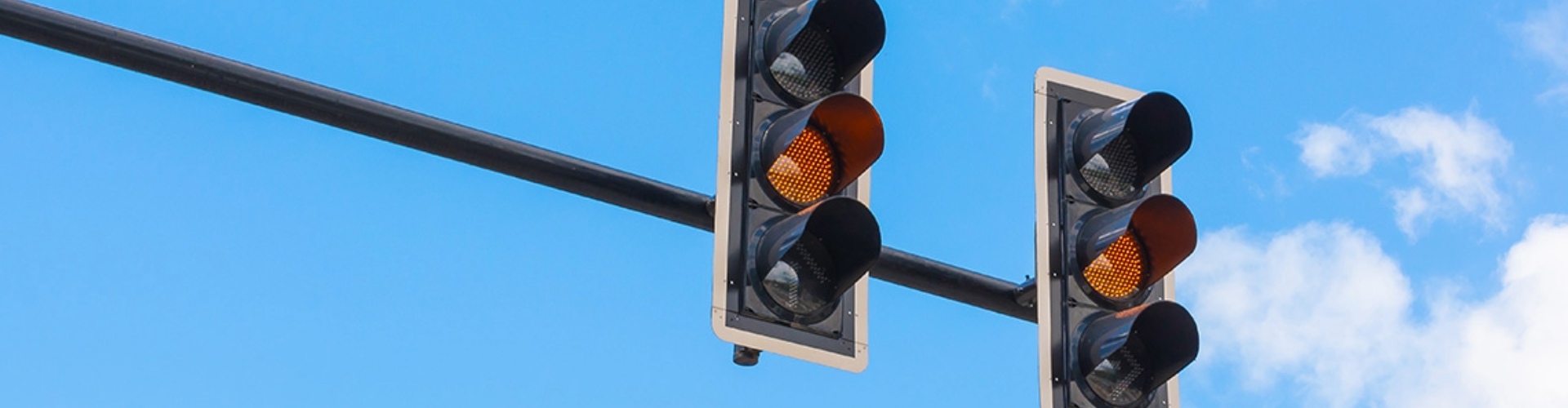 Traffic lights against a blue sky
