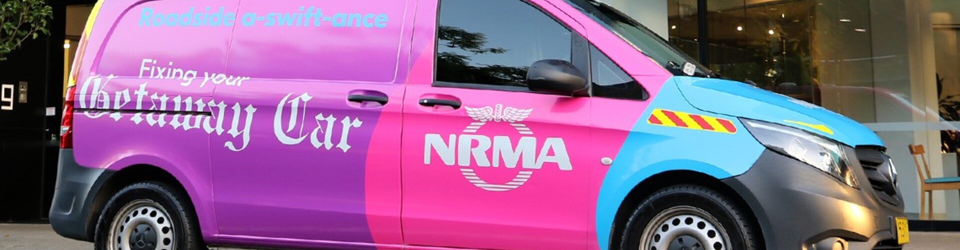 A customised pink Taylor Swift NRMA patrol van parked on the street