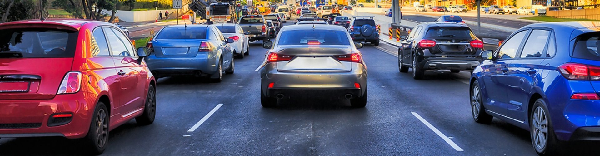 Rear view of traffic heading toward the Sydney Harbor Bridge.