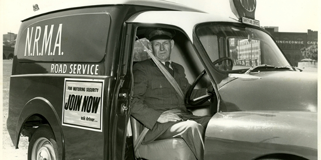 Patrolman wearing a seatbelt in an NRMA van 1960s