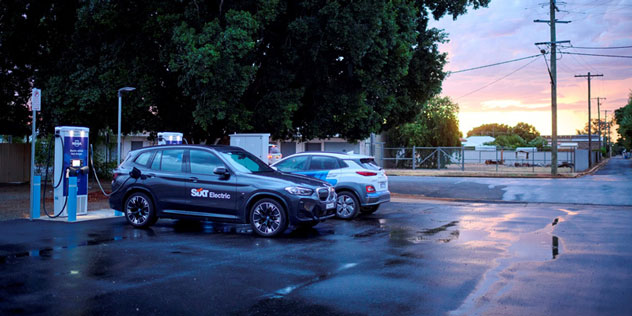 A SIXT branded EV charging in the evening