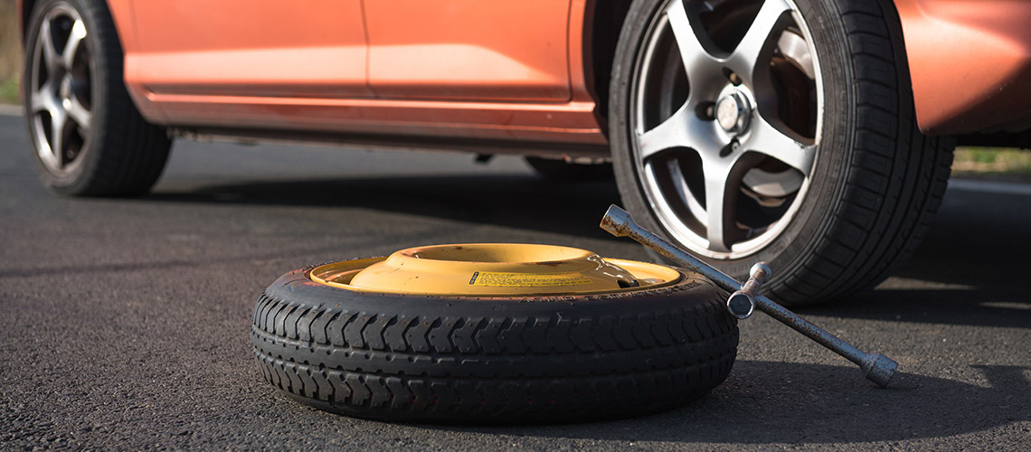 Emergency tyre on the road at breakdown Emergency tyre on the road at breakdown