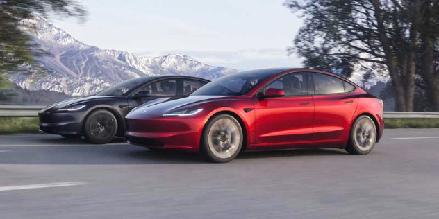 A pair of Tesla Model 3 Long Ranges driving side by side