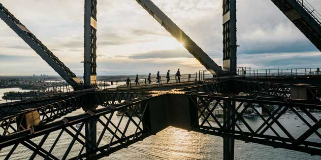 People climbing SYdney Harbour Bridge