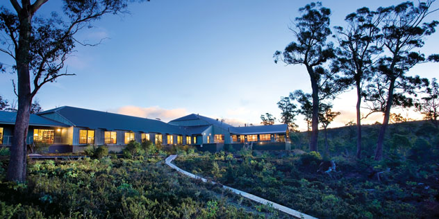 Cradle Mountain Hotel in the evening with lights on