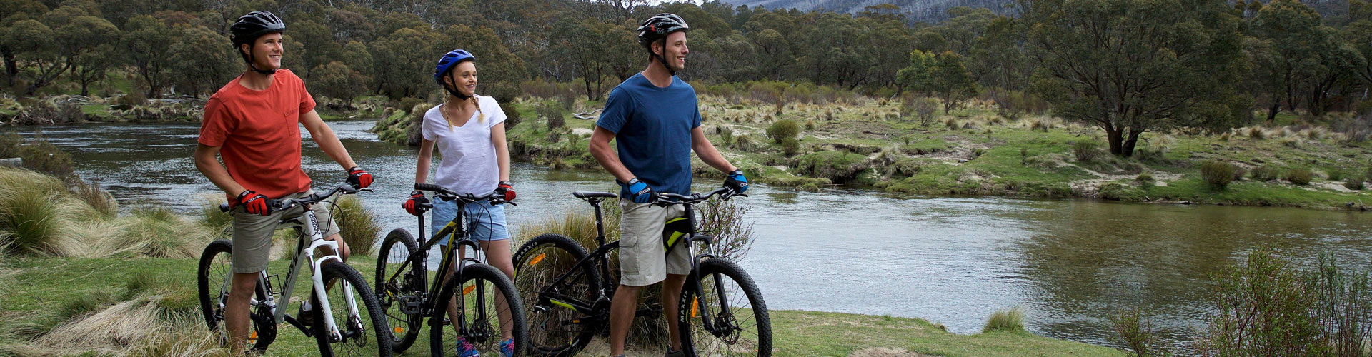A group of mountain bike riders on a bush trail in the Snowy Mountains