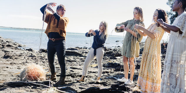 People winding straw on rocks - Delvene Cockatoo Collins