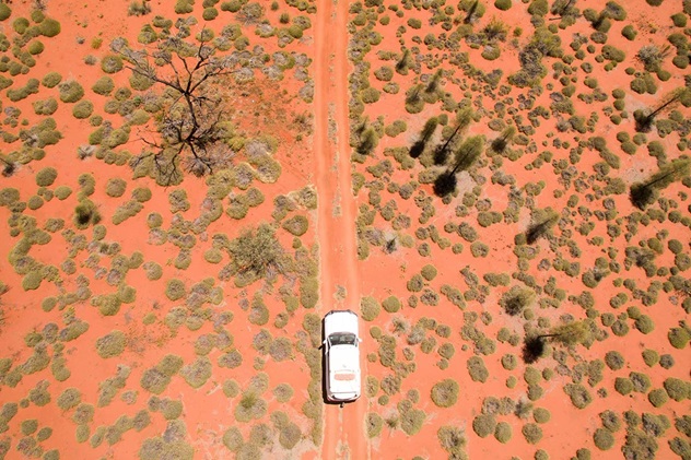 Aerial view of car driving in the Simpson desert