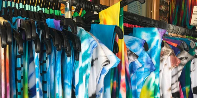 Tie dyed shirts hanging on a rack in Byron Bay
