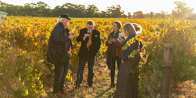 four people in a winery