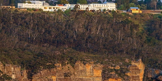 white buildings of the historic hydro majestic hotel viewed from above the Megalong valley