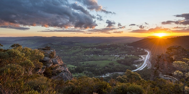 arial view of blue mountains highway cutting through the countryside