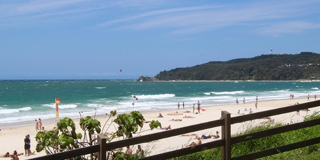 people enjoying a white sandy byron bay beach 